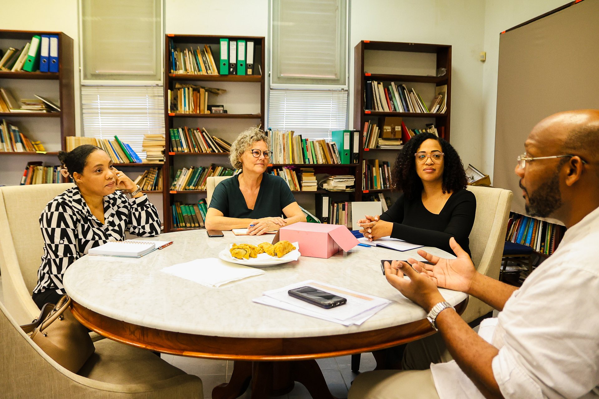Board meeting around a round table in the library